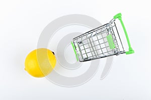 Buying lemons. trading concept. Online shopping concept. Cart and lemons over a white background. business concept. Healthy eating