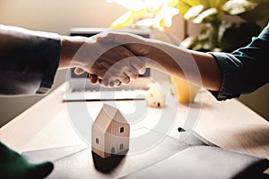 Buying a New House Concept. Real Estate Agent making Handshake with Customer. photo