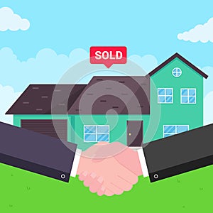 Buying new house on sale. Two hands shaking,