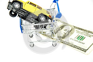 Buying new yellow car dollars on background