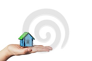 Buying and selling real estate. Mortgage loan. Miniature little house on the palm of the hand on the white background. Rent home.