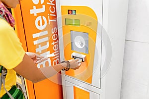 Buying or validating ticket in punching machine for the train or metro