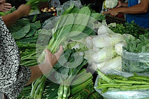 Buying Vegetables at Fresh Market