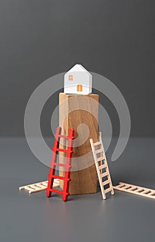 Buying your own home becomes an unattainable dream. The ladder symbolizes an affordable mortgage. increasing bills. Inability to photo