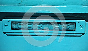 Buzon de cartas azul en la fachada de una vivienda unifamiliar photo