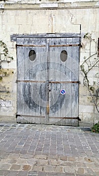 Bygone era faded wooden garage doors