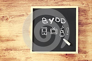 Byod concept written on blackboard