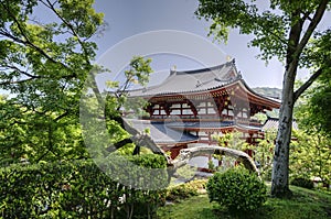 Byodo-in temple between trees in Uji, Japan