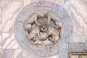 Byzantine mythical creature with four bodies sharing a single head, executed in marble, wall of the basilica of St Mark, Venice