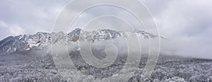 Aerial panoramic view of the famous BÃÂ©l-kÃâ mountain on a foggy cloudy winter morning. photo