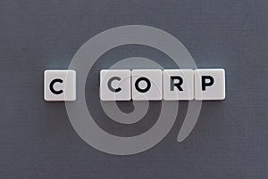 C corp word made of square letter word on grey background photo