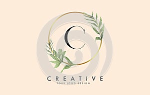 C Letter logo design with golden circles and green leaves on branches around. Vector Illustration with C letter