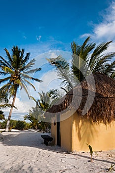 Cabanas huts on white sand beach in Mexico Tulum photo