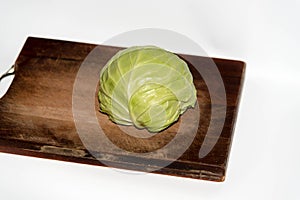 Cabbage on the chopping borad on white background