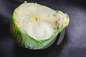 cabbage and cutted cabbage on wooden