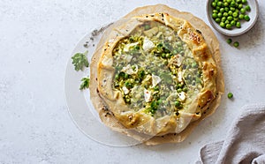 Cabbage, green peas and feta cheese open face piegalette close up