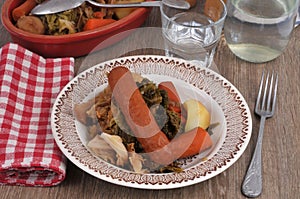 Cabbage hotpot served in a plate with a glass