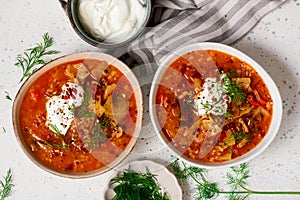 Cabbage rolls soup in a ceramic bowl on a table. .style hugge