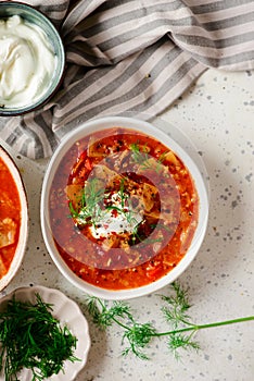 Cabbage rolls soup in a ceramic bowl on a table. .style hugge