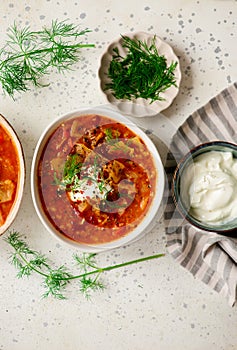 Cabbage rolls soup in a ceramic bowl on a table. .style hugge