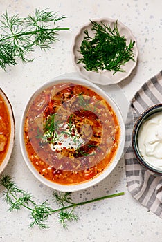 Cabbage rolls soup in a ceramic bowl on a table. .style hugge