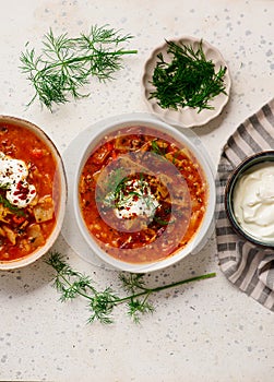Cabbage rolls soup in a ceramic bowl on a table. .style hugge