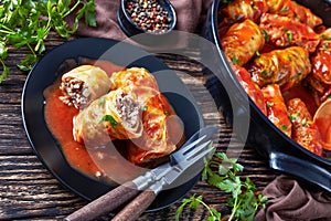 Cabbage rolls served on a black plate