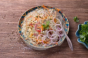 Cabbage salad with carrots, red pepper, onions, cilantro and spices