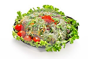 Cabbage salad with red caviar garnished with cherry tomatoes and lettuce. Japanese food