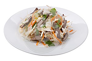 Cabbage salad with young veal on a plate, healthy food, on a white background, isolate