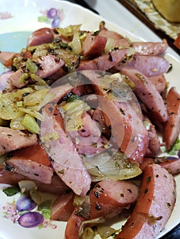 Cabbage and sausage with onions and peppers sauteed