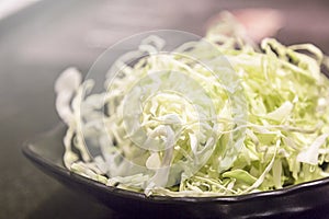 Cabbage slice in black plate