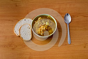 Cabbage soup knwos in Poland as kapusniak with bread.