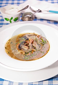 Cabbage soup shchi with french plum and bacon