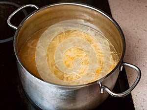 Cabbage soup with stewed sauerkraut in stockpot