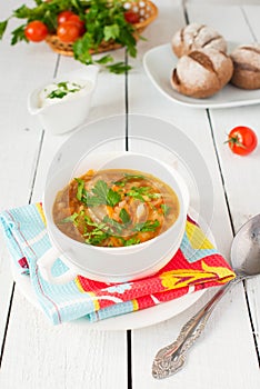 Cabbage soup with tomato and greenery
