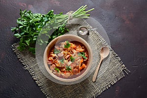 Cabbage stew with grilled sausage in tomato sauce -