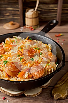 Cabbage stew with grilled sausage
