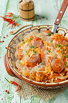 Cabbage stew with grilled sausage