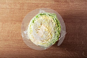 Cabbage vegetable in plastic bag. single use plastic packaging issue