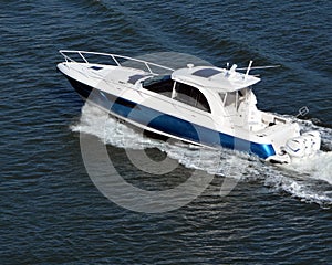 Cabin Cruiser Powered by Three Outboard Engines photo