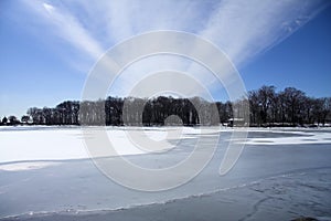 Cabin on frozen lake photo