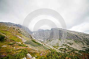 Cabin lift to the mountain. Mountain landscape in High Tatry. Chairlift at the ski resort in a cloud. Ski lift, cable car cabin in