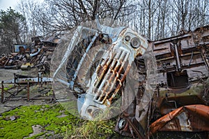The cabin of an old abandoned and rusty soviet truck at the scrap yard