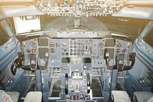 Cabin pilots aircraft view of the windshield, steering wheels, control devices.