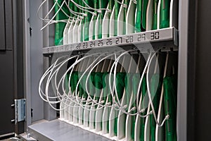 Cabinet of charging tablets neatly organized for use in classroom education setting