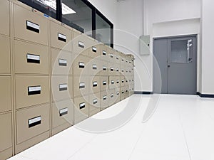 Cabinet for document storage.The filing cabinet is located on th