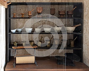 Cabinet full of mortars and pestles in Post Hospital at the Fort Davis National Historic Site in Fort Davis, Texas.