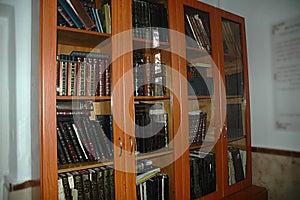 A cabinet with Jewish holy books. Torah, Siddur, Talmud, Tanakh. Synagogue in Israel photo