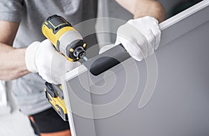 Cabinetmaker with a Drill Driver in His Hand